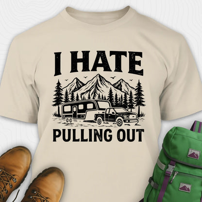 Beige t-shirt with 'I Hate Pulling Out' graphic design, brown boots, and green backpack on a white background