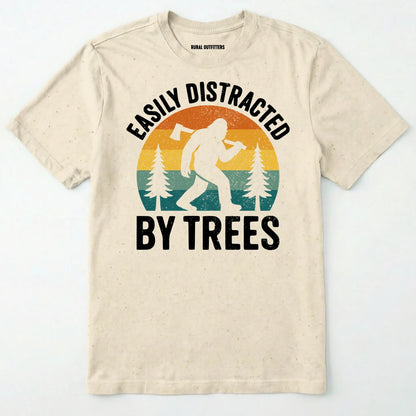 Natural funny sasquatch shirt featuring bigfoot silhouette and trees on a white background.