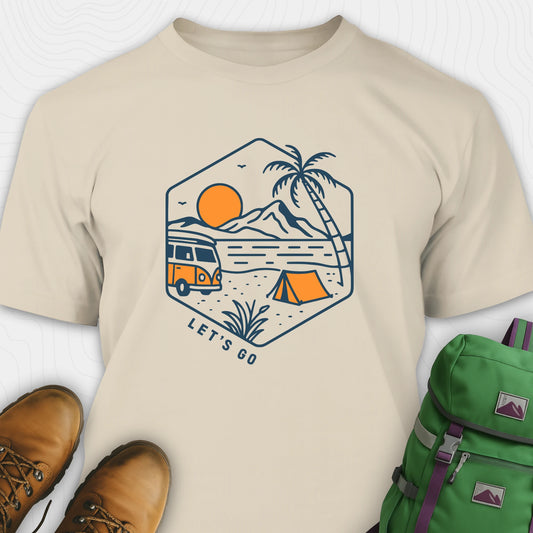 Beige let’s go t-shirt with retro camper van and sunset graphic, and green backpack on a white background
