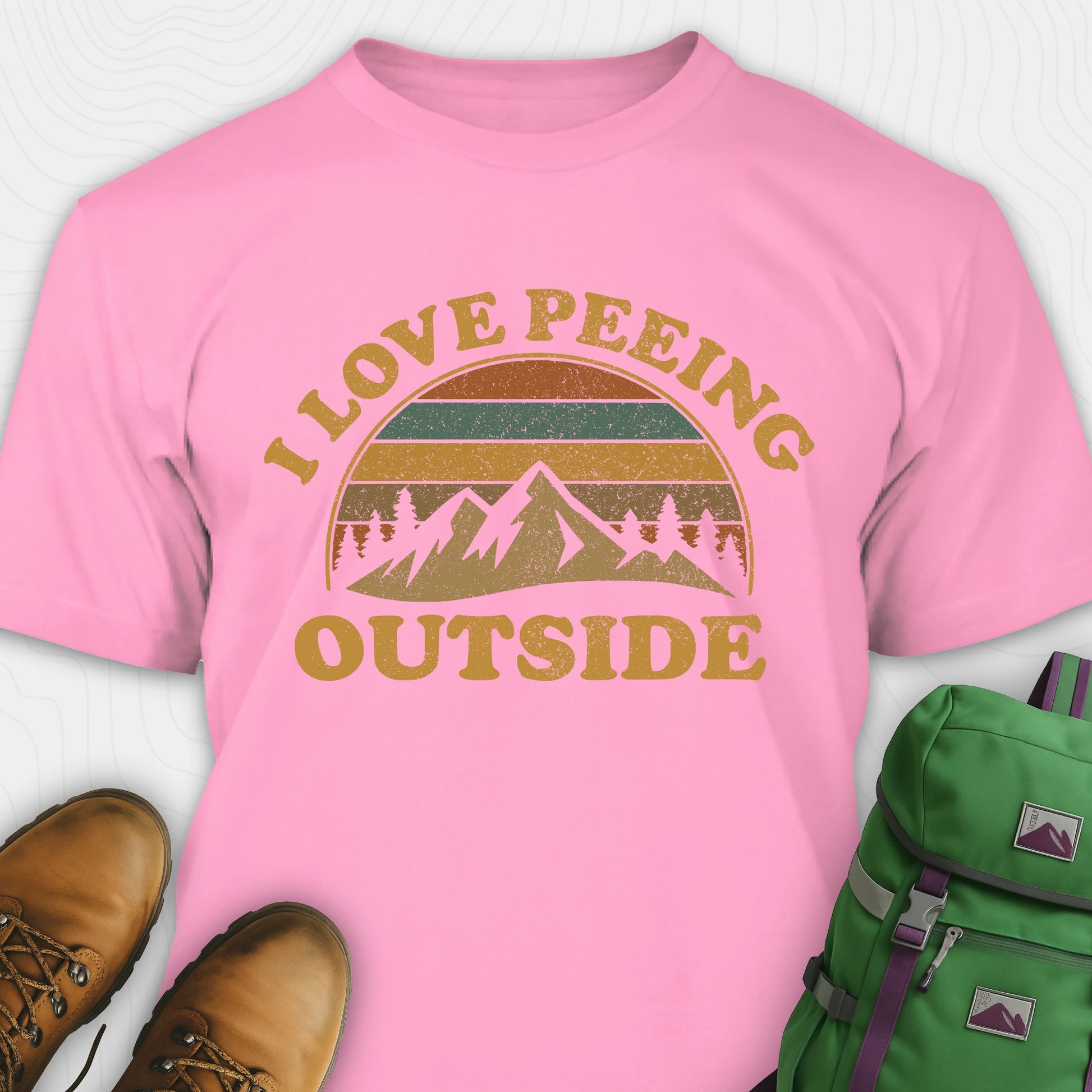 Pink I pee outside shirt with retro mountain graphic