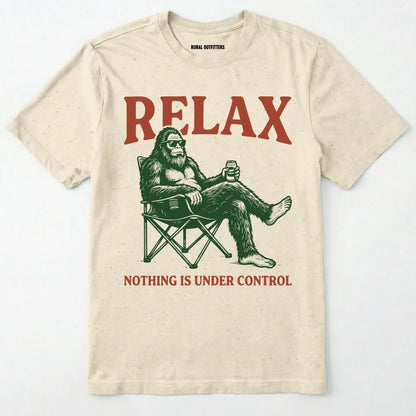 Natural Relax Nothing is Under Control t-shirt with a graphic of a relaxed bigfoot drinking beer on a white background.