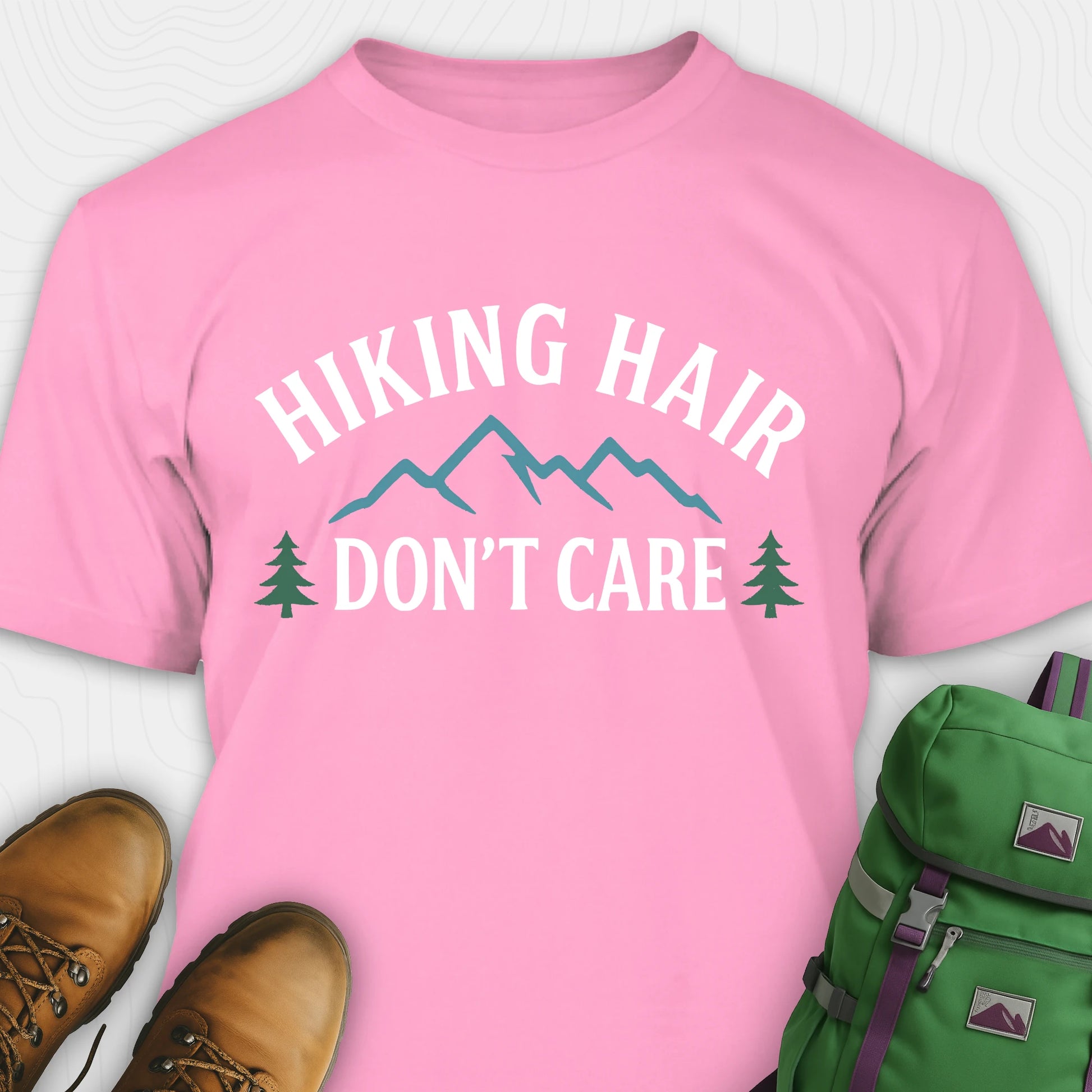 Pink hike shirt with mountain silhouette and pine trees
