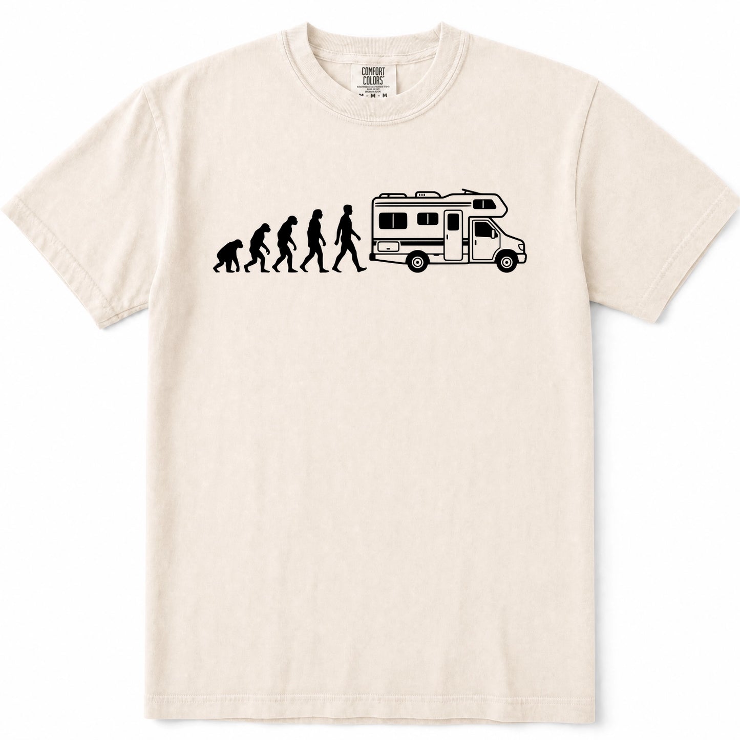 Ivory crewneck t-shirt featuring a black graphic print of the evolution of man transforming into a woman, who then drives a white and black camper RV. The shirt is displayed flat against a clean white background.