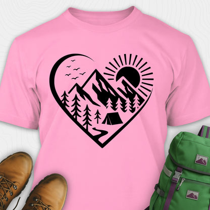 Pink nature t-shirt featuring heart graphic with mountains, trees, and tent illustration