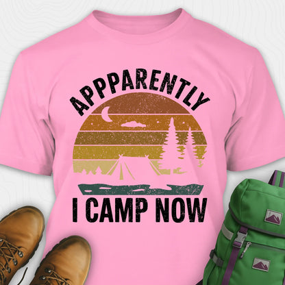 Azalea t-shirt with “Apparently I Camp Now” in white text and a vintage sunset camping scene with tent, trees, and moon.