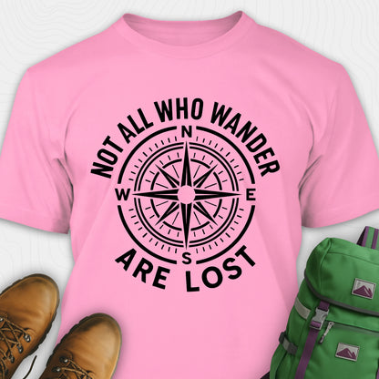 Azalea Not All Who Wander Are Lost T-shirt with compass design and text, paired with boots and a backpack on a white background