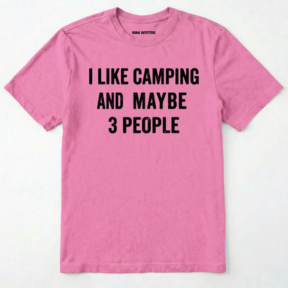 Azalea short-sleeve t-shirt with bold black text reading 'I LIKE CAMPING AND MAYBE 3 PEOPLE' across the chest, laid flat against a light off-white background.