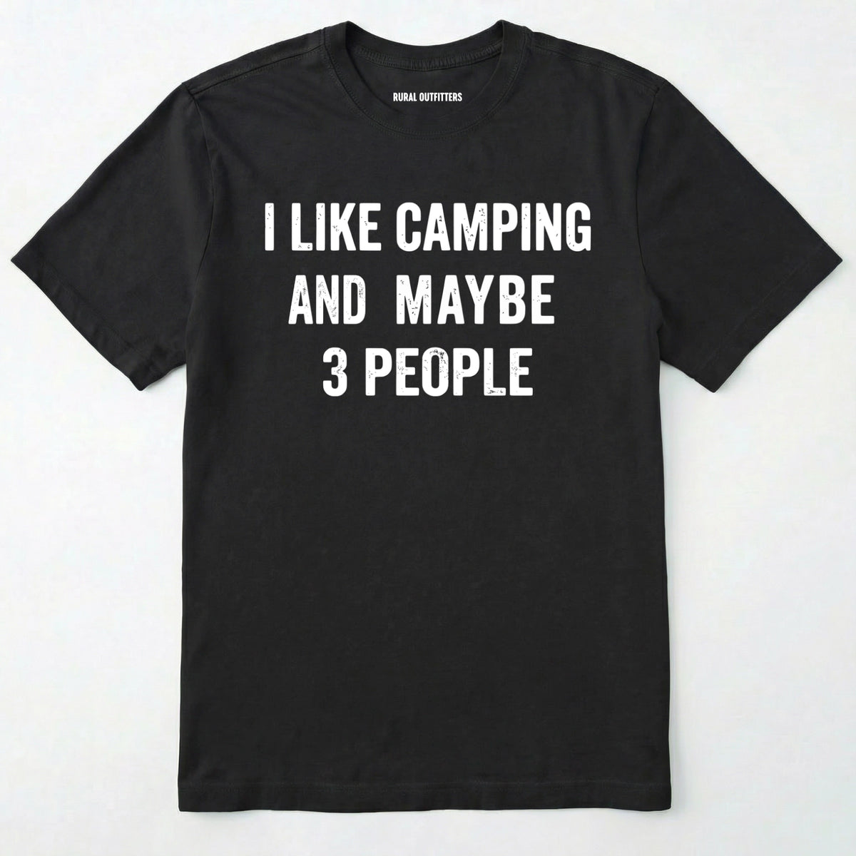 Black short-sleeve t-shirt with bold white text reading 'I LIKE CAMPING AND MAYBE 3 PEOPLE' across the chest, laid flat against a light off-white background.