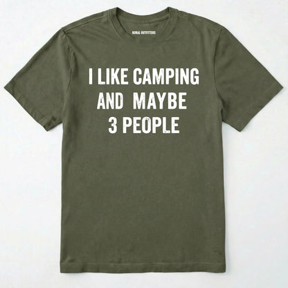Military Green short-sleeve t-shirt with bold white text reading 'I LIKE CAMPING AND MAYBE 3 PEOPLE' across the chest, laid flat against a light off-white background.