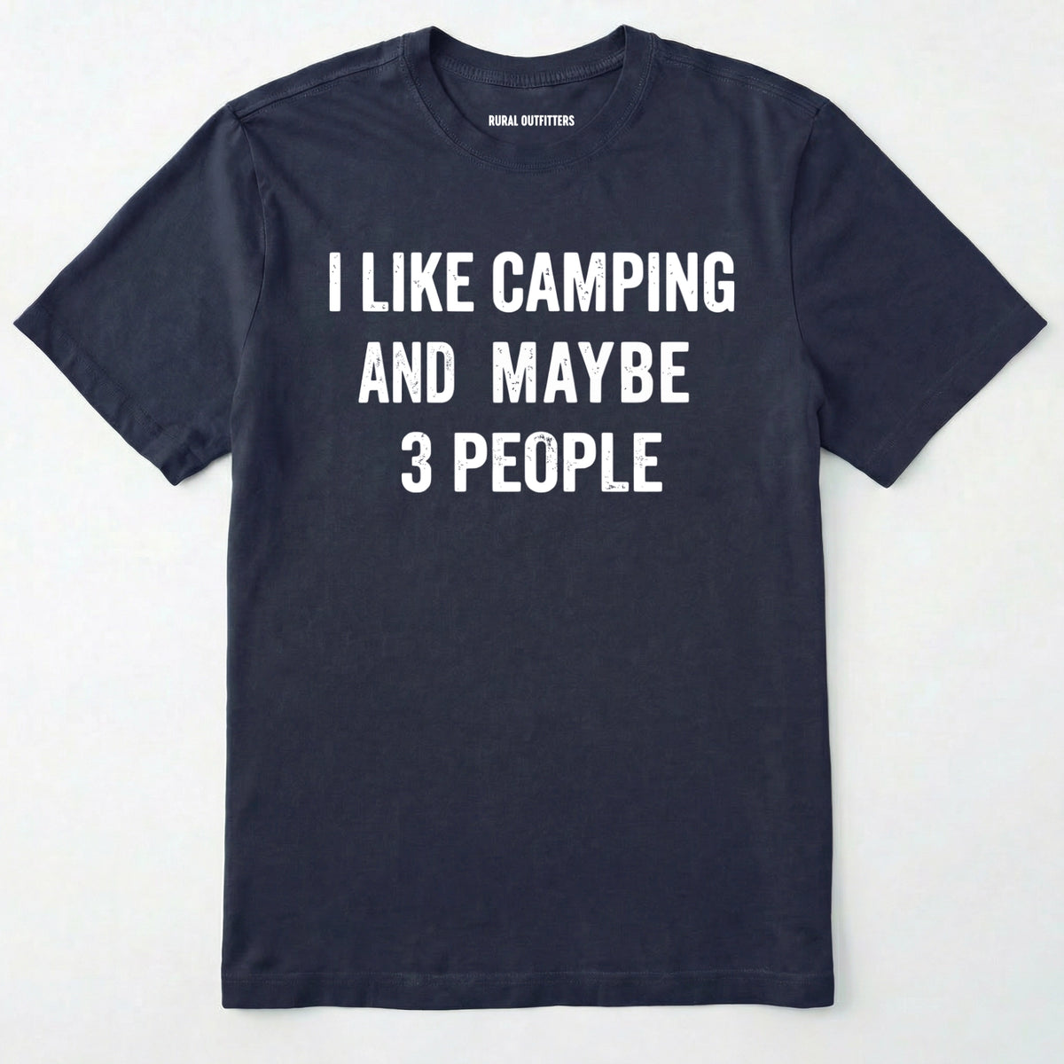 Navy blue short-sleeve t-shirt with bold white text reading 'I LIKE CAMPING AND MAYBE 3 PEOPLE' across the chest, laid flat against a light off-white background.