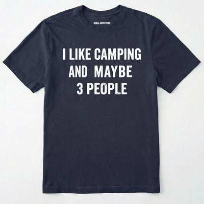 Navy blue short-sleeve t-shirt with bold white text reading 'I LIKE CAMPING AND MAYBE 3 PEOPLE' across the chest, laid flat against a light off-white background.